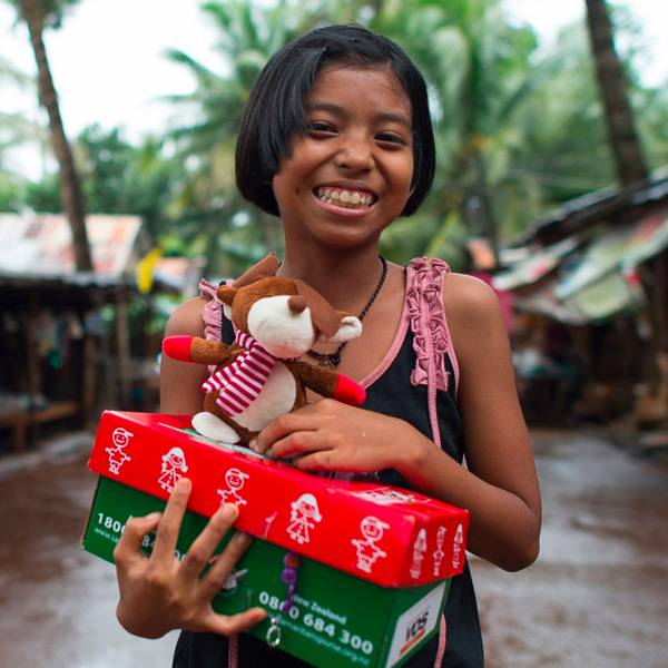 serve by packing a shoe box of joy